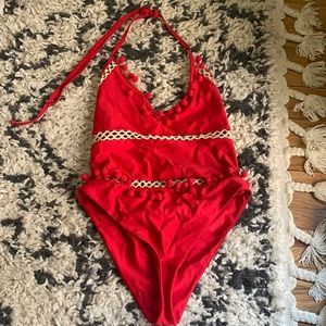 Tularosa one-piece swim suit with pom trim